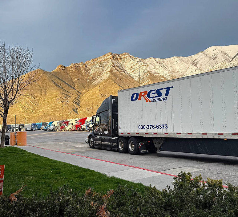 Black OREST Express truck standing at a truck stop in the mountains